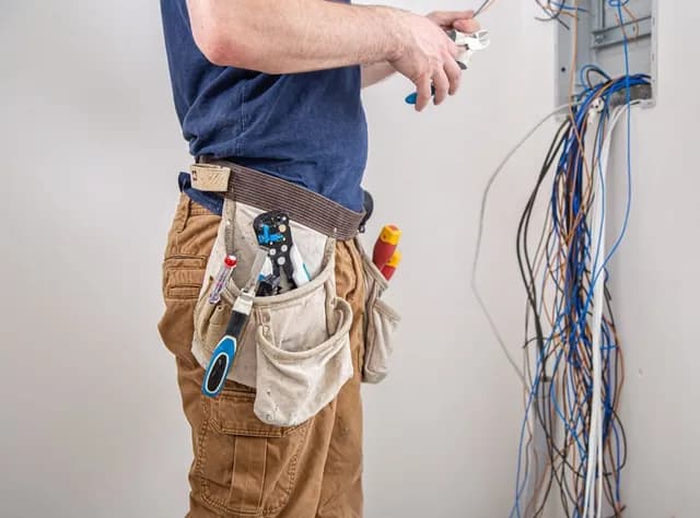 Technician working on electrical wiring